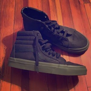 NWT black hi top vans. size 8.